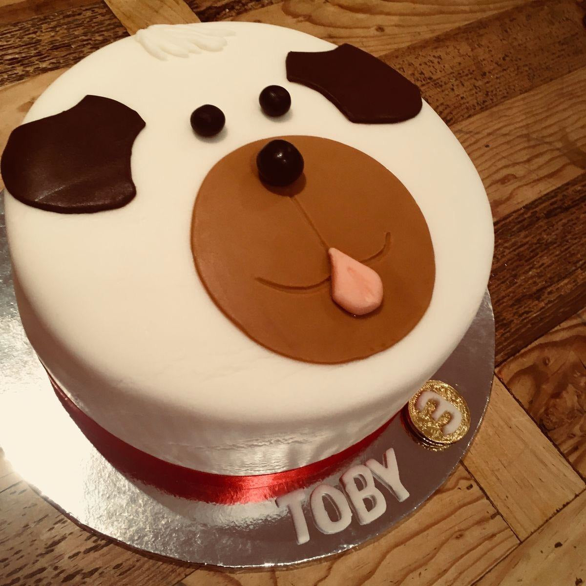 Toby Paw Cake featuring a cute dog face design, made with pet-safe ingredients, perfect for celebrating your furry friend's birthday.